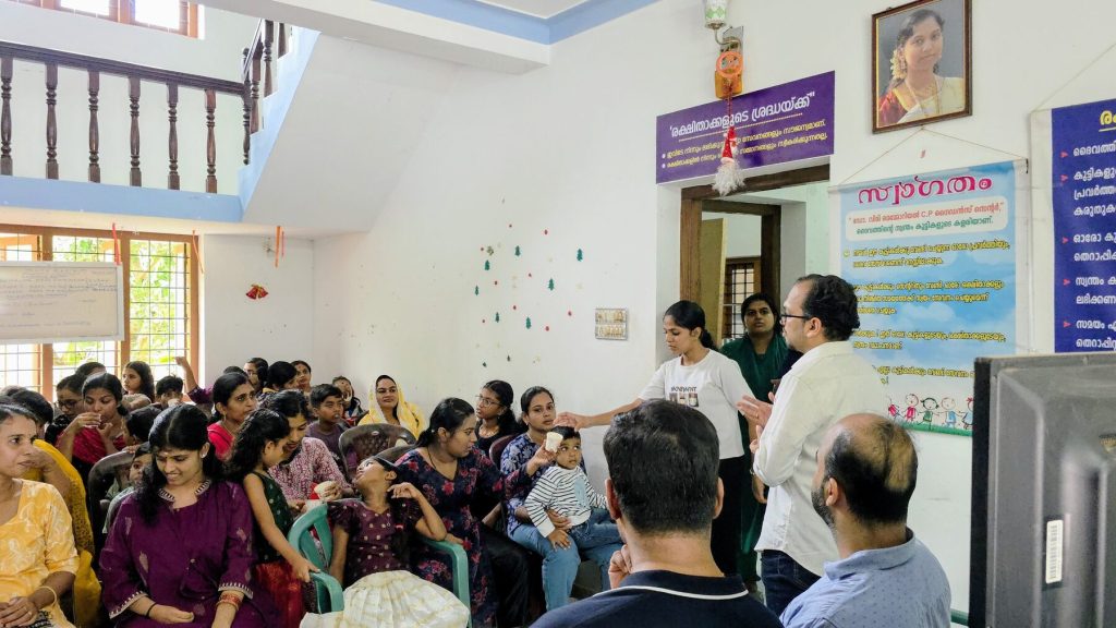 Parents and children filling the hall of the guidance centre