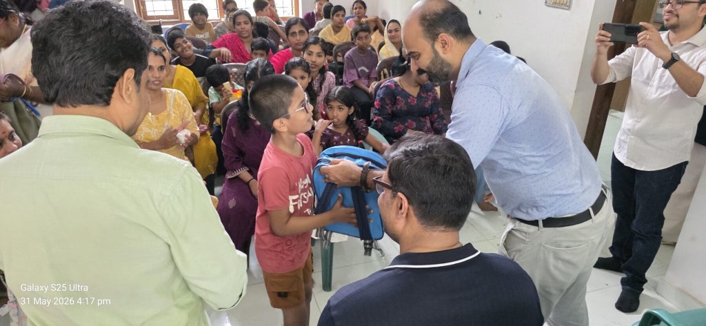 A child receiving a school bag at the distribution on 31 May 2026