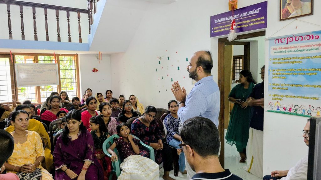 A society member greeting families gathered at the guidance centre
